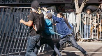 youth tearing down a barricade