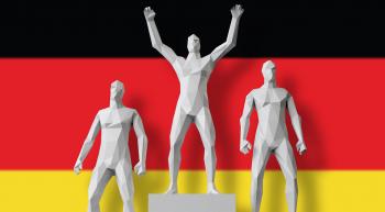 men on award podium in front of German flag