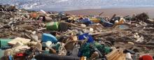 a beach strewn with plastic garbage