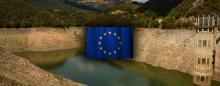 Almost empty Spanish reservior with EU flag in center