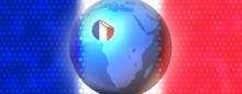 globe showing African continent with a sticker of a French flag being peeled off