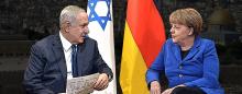 Netanyahu and Merkel with German and Israeli flags