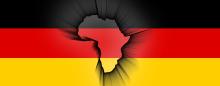 The shape of the African continent superimposed over the German flag