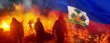 rioters burning cars and a flag of Haiti overlaying the upper right corner